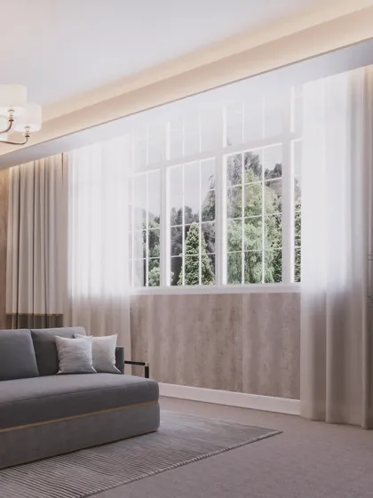 This view shows the seating area by the large, classic window, creating a peaceful space for relaxation.