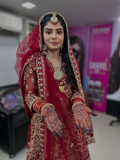 My beautiful bride ready for her Nikah ceremony. She is wearing a traditional red sharara, and her makeup is classic and timeless.
