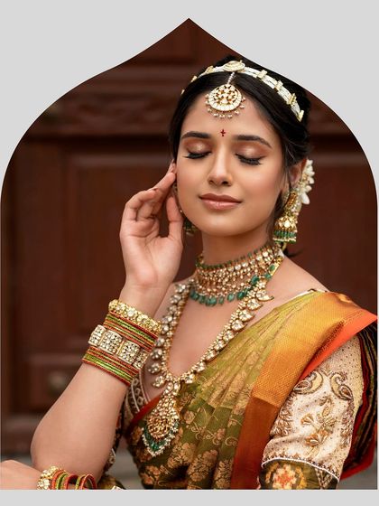 A duplicate image showing a serene moment, capturing the bride's elegant profile and the intricate details of her jewelry and custom-embroidered blouse.