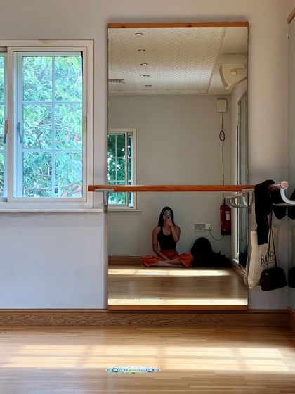 A quiet moment of reflection in the studio. The dance studio is my sanctuary, a place for both intense work and peaceful solitude.