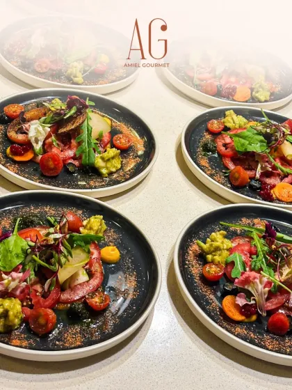 A beautiful lineup of tomato carpaccio salads, artfully plated and ready to be served. We craft each dish with French mastery and elegance, perfect for those who host to impress.
