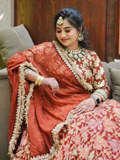 A candid shot, her makeup glowing in the light.