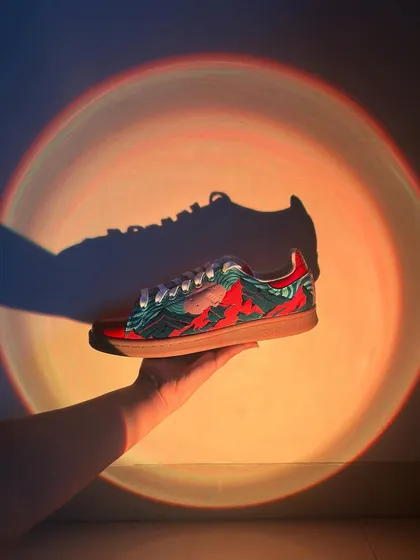 This project was a mad experiment with trippy visuals on a pair of Adidas Stan Smiths. The goal was to create something that feels like an optical illusion, with bold colors and wavy patterns that really stand out, especially under cool lighting.
