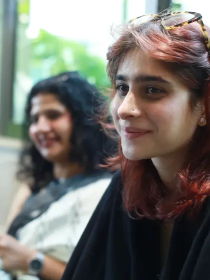 Another portrait from the doula meetup. This close-up focuses on an attendee's engaged expression, highlighting the collaborative and supportive atmosphere of the event.