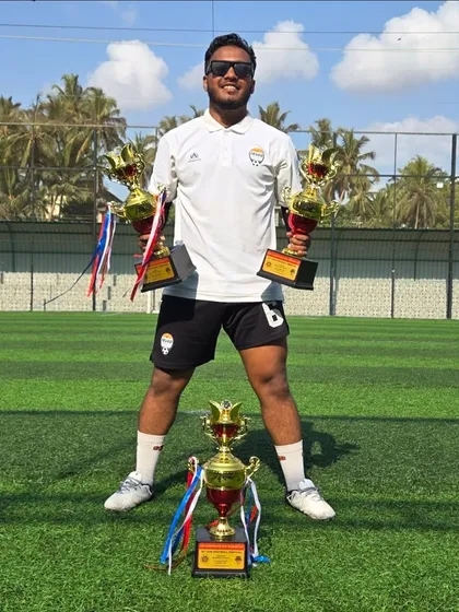 Coach Awais Shaikh celebrating the academy's triple-trophy win in Goa.