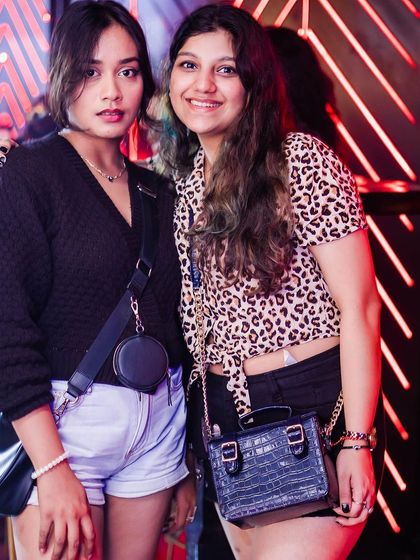 Two friends posing for a photo.