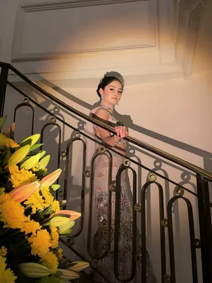 An artistic shot of a bride in a pastel gown, creating a timeless and elegant portrait.