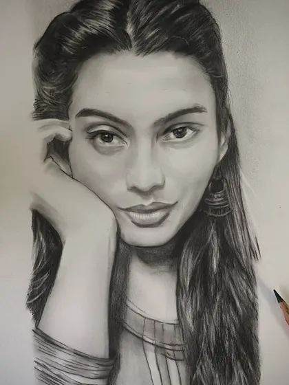 A detailed pencil portrait focusing on the subject's expressive eyes and serene look.