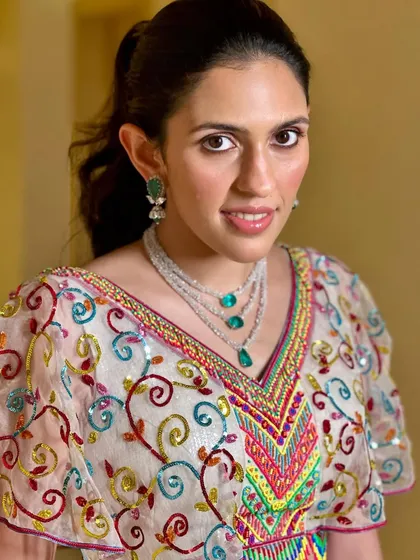A close-up of the intricately embroidered blouse from the Abu Jani Sandeep Khosla lehenga, showing the beautiful mix of colors and craftsmanship.
