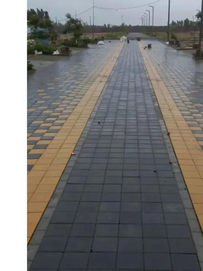 A patterned streetscape in a new layout development. We believe pedestrian-friendly streets are crucial for a connected community, and we use paving patterns to define walking zones and add character.
