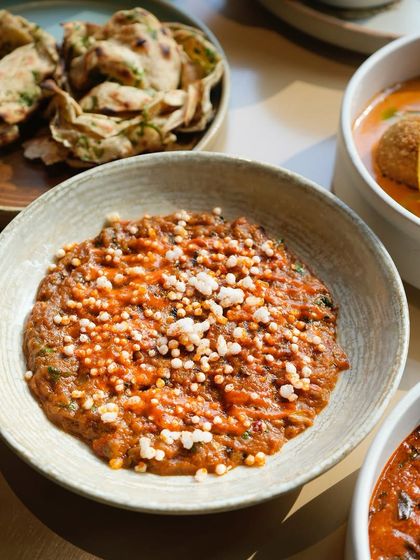 Our take on Baingan Bharta, a smoky eggplant mash that is a winter specialty. The deep, roasted flavor makes it a comforting and delicious option for any vegetarian spread.