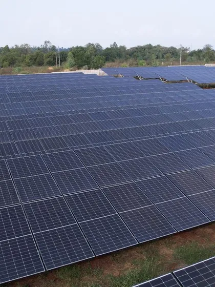 This close-up aerial view highlights the precision and density of our solar panel arrays in a 1.3 MW project. Our engineering ensures optimal land use and energy output for every utility-scale solar farm we build.