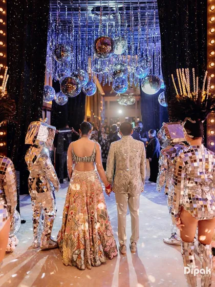 A grand entrance into a night of celebration under a ceiling of disco balls at the Taj Palm Dubai. I specialize in capturing the high-energy moments of your Sangeet and Cocktail nights, creating cinematic visuals that reflect the glamour and excitement of your party.