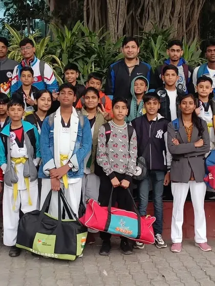 The full team posing outside the Talkatora Indoor Stadium, ready for a day of competition.