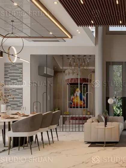 An open-plan living and dining area in Model Town, where a dedicated temple space is elegantly integrated into the design, separated by a sleek metal screen.