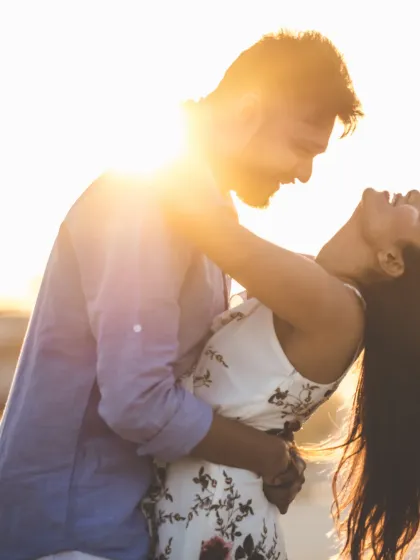 A moment of pure joy and romance under the desert sun. The golden light and the couple's laughter make this an unforgettable shot from their Dubai destination shoot.