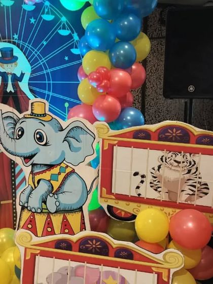 A close-up of the elephant and tiger cutouts from the carnival theme, which add to the fun atmosphere of the game-filled party.
