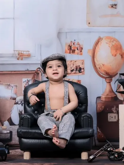 A dapper little traveler sitting in a miniature armchair, looking ready for an adventure.