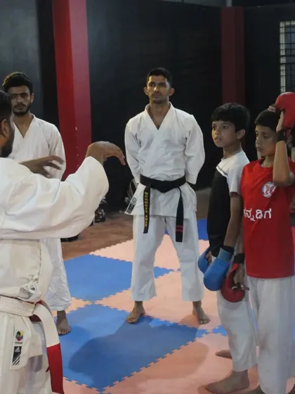 An examiner provides feedback to students during the belt grading. This guidance is crucial for their continued development as martial artists.