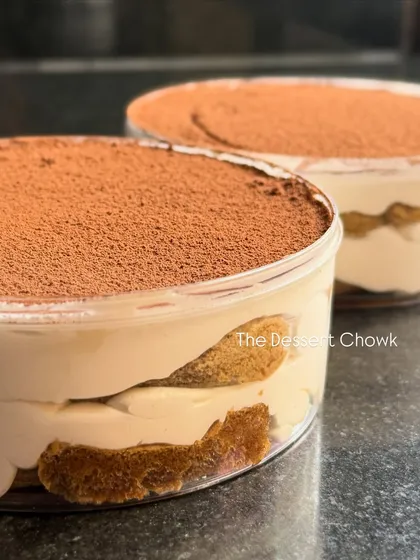 My classic Tiramisu tubs are a coffee lover's dream. I layer coffee-soaked ladyfingers with light and airy mascarpone cream, finished with a generous dusting of cocoa powder. They are available in 300gms and 500gms sizes.