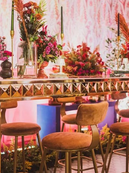 A close-up of the high-top bar seating, showing the rich textures and colors I use to create a luxurious and inviting atmosphere for guests.