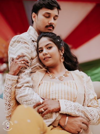 An intimate portrait of the couple, with the bride resting her head on the groom's shoulder.