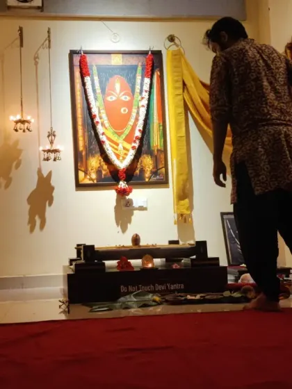 I am making final preparations before the Devi Abhishekam begins. Ensuring the space is perfectly set is an offering in itself, done with utmost care and reverence.