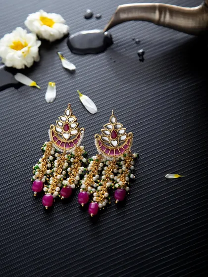 Elegant chandbali earrings with pink beads and pearls. I added water droplets and flower petals to create a fresh, artistic product shot that tells a story.