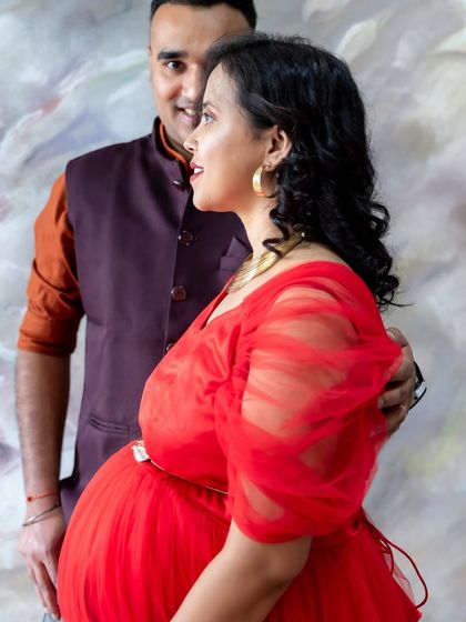 A candid and joyful moment between a couple during their studio session.