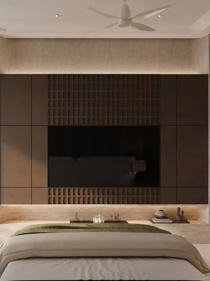 The view from the bed, showcasing the impressive, full-height media wall. The design uses rich materials to create a space that feels both opulent and harmonious.