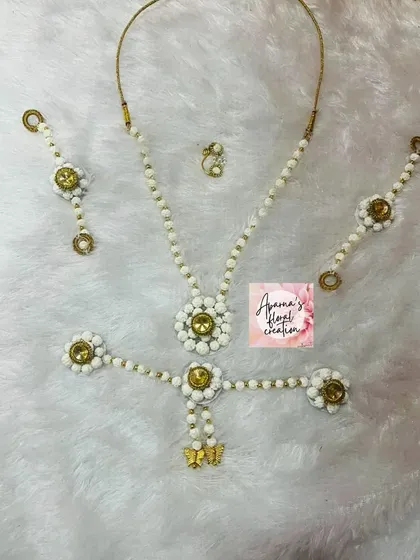A delicate halwa jewellery set designed specifically for a baby girl's 'bor nhan' ceremony.