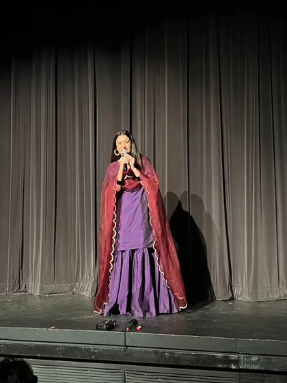 The stage is a space where I can act as the 'sootradhar', the thread-holder, weaving stories together to connect with the hearts of the audience. Here, I was hosting and narrating a theatrical show, a role that reminds me of the importance of every part in creating a beautiful whole.