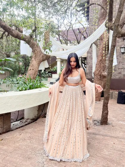 The full view of my pastel lehenga, showing how the mirror work catches the light. It’s a great example of a modern yet traditional wedding outfit.