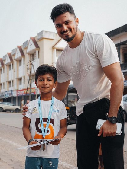 A personal moment with one of the young participants. It's a privilege to be a role model for the next generation in my community.