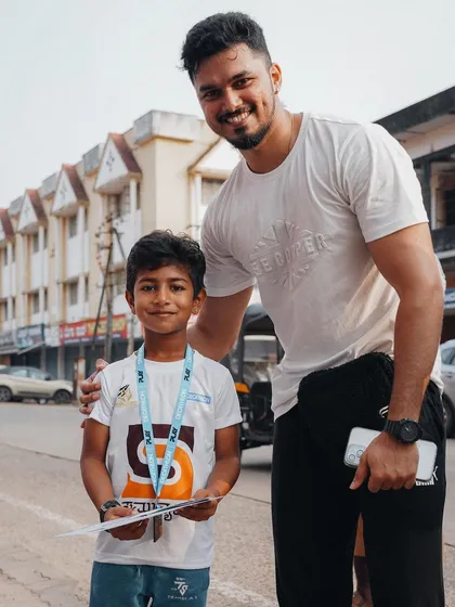 A personal moment with one of the young participants. It's a privilege to be a role model for the next generation in my community.