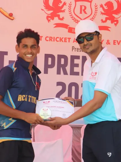 A player from the runner-up team, RCA Titans, receives his certificate. Every team fought hard.