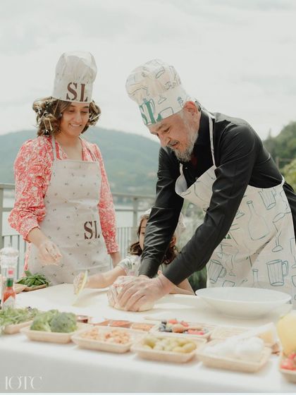 Guests kneading dough and creating their own pizzas, a truly hands-on and enjoyable wedding activity.