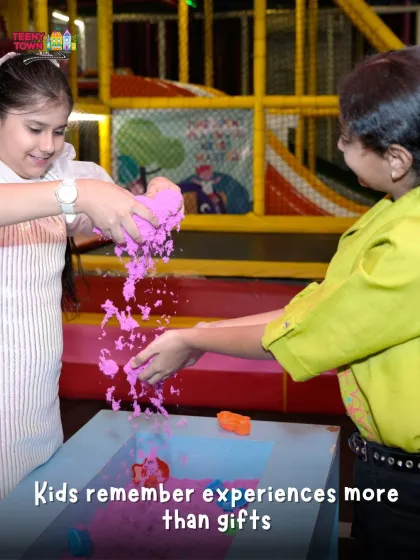 Experiences are the best gifts. Here, kids are enjoying our kinetic sand station, a sensory activity that is both fun and great for their development.