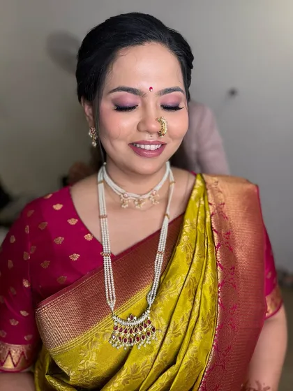The closed-eye shot highlights the beautiful blend of pink eyeshadow, perfect for a daytime wedding ceremony.