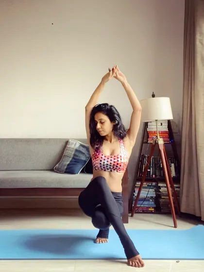 A moment of focus in a toe stand, a challenging variation that requires deep concentration and ankle stability.
