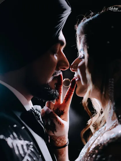 A playful and creative ring shot. This kind of fun interaction is what I encourage to get photos that are both unique and personal to the couple.