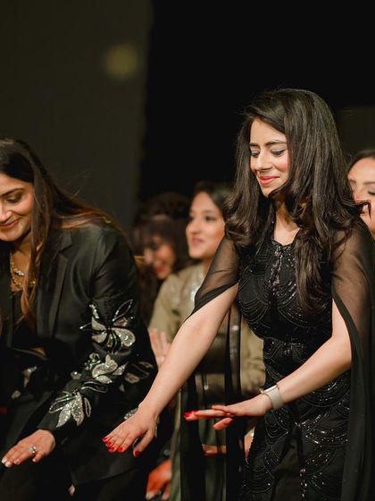 A candid shot from a group rehearsal. Even practice sessions are full of laughter and fun.