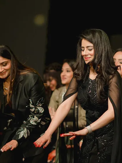 A candid shot from a group rehearsal. Even practice sessions are full of laughter and fun.