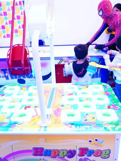 Even superheroes need to play! Here's Spider-Man joining the kids for a game of 'Happy Frog' during a superhero-themed birthday bash.