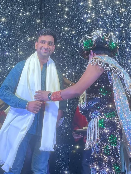 Receiving a shawl from Magician Ajooba ji on stage. This gesture of respect from a senior artist means the world to me.