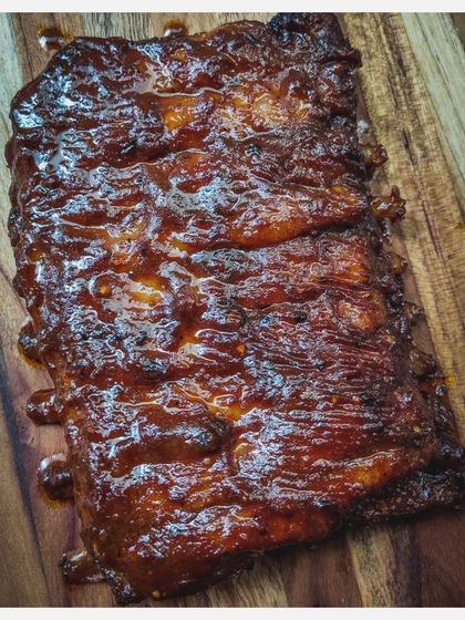 Another angle of the Barbeque Pork Ribs, highlighting the juicy, fall-off-the-bone tenderness of the meat.