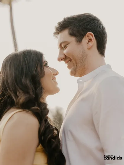 A close-up of the couple, lost in each other's gaze. This shot is all about the connection and happiness shared between them.