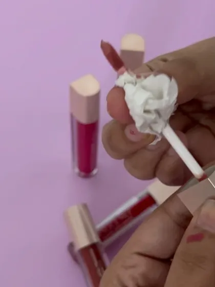 The not-so-glamorous side of product photography: cleaning lipstick off an applicator for the next shot.