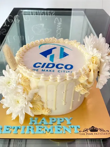 Celebrate a career milestone with an elegant and personalized cake. This white chocolate drip cake, made for a retirement party at CIDCO, combines the company logo with tasteful floral decorations for a sophisticated finish.