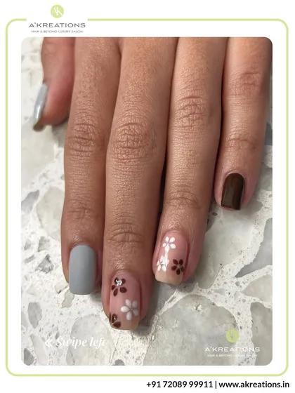A full view of the earthy floral manicure, showcasing the elegant combination of patterns and solid colors for a sophisticated nature-inspired look.